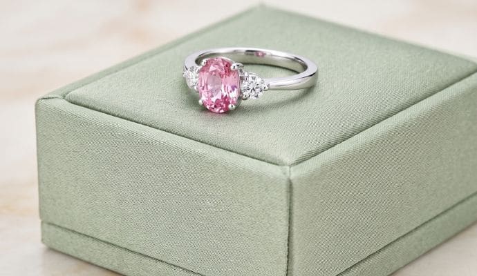 Natural pink sapphire ring in white gold with diamond pavé band