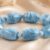 Aquamarine barrel-shaped bead bracelet featuring polished blue gemstone beads