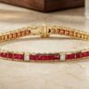Yellow gold channel-set ruby and diamond tennis bracelet with princess-cut rubies