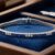 White gold channel-set sapphire and diamond tennis bracelet displayed in luxury blue jewelry box