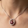 Oval ruby diamond halo pendant necklace in white gold