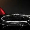 Dainty natural diamond bar bracelet in white gold on black marble display