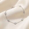 Diamond by the yard natural diamond bracelet in white gold on soft satin background