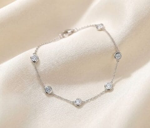 Diamond by the yard natural diamond bracelet in white gold on soft satin background
