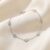 Diamond by the yard natural diamond bracelet in white gold on soft satin background