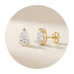 Pear diamond stud earrings in yellow gold