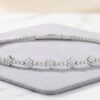 White gold natural diamond flexible beaded flower cluster bangle featuring sparkling floral motifs