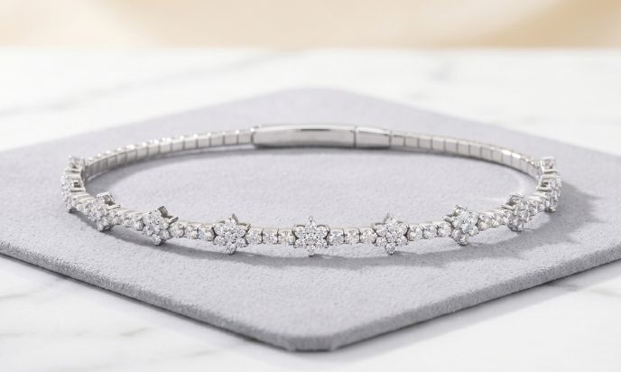 White gold natural diamond flexible beaded flower cluster bangle featuring sparkling floral motifs