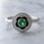 Natural emerald ring in 14K white gold with black enamel and diamonds