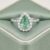 Natural Paraiba tourmaline pear-shaped ring in white gold with diamond halo