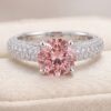 Natural emerald engagement ring in white gold with diamond halo