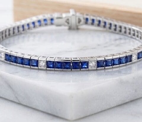 White gold sapphire and diamond tennis bracelet with alternating princess-cut gemstones