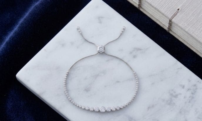 Adjustable natural diamond bolo bracelet with graduated round brilliant diamonds