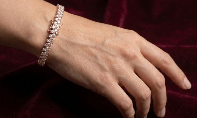 Shaped illusion natural diamond tennis bracelet on wrist