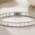 White gold two-row beaded flexible bangle with natural diamond petite flower cluster accents