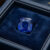 Blue Sapphire cushion cut gemstone in jewelry box