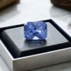 Blue Sapphire cushion cut gemstone in jewelry box