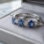 Blue Sapphire and Diamond Half Eternity Ring