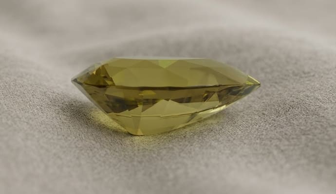 Natural Chrysoberyl elongated faceted gemstone with golden yellow-green color