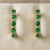 Green Tsavorite and Diamond Hoop Earrings Displayed in Jewelry Box