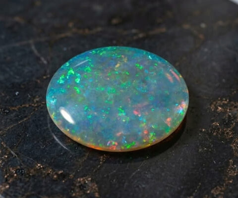 Natural Australian Crystal Opal oval cabochon with vivid green and multicolor flashes