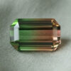 Natural bicolor tourmaline rectangular cut gemstone with green and brown tones
