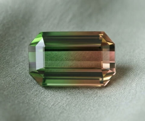 Natural bicolor tourmaline rectangular cut gemstone with green and brown tones