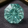 Natural octagonal blue green tourmaline gemstone on dark jewelry display