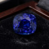 Natural blue sapphire gemstone with GIA report displayed on black velvet jewellery box