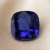 Natural blue sapphire with GIA report on soft beige fabric