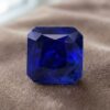 Natural blue sapphire with GIA report on beige fabric