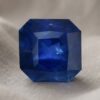 Natural blue sapphire with GIA report on soft beige fabric