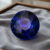Natural round blue sapphire with GIA report on grey jewelry tray