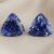 Natural trillion cut blue sapphire matching pair on soft beige fabric