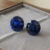 Natural blue sapphire matching pair on soft grey jewelry tray