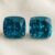 Natural cushion cut blue zircon matching pair on soft cream fabric