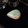 Natural Brazilian opal gemstone on black jewelry display