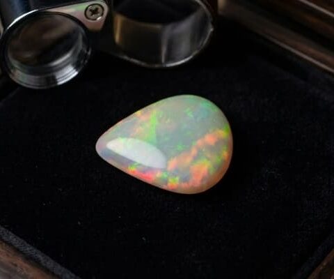 Natural Brazilian opal gemstone on black jewelry display