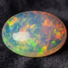 Natural Brazilian opal gemstone on dark velvet fabric