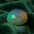 Natural Brazilian opal gemstone on green velvet fabric
