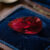 Natural pear shaped Burma ruby gemstone on blue velvet jewelry display