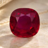 Natural cushion cut Burma ruby with GIA report on soft cream fabric