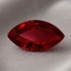 Natural marquise cut Burma ruby gemstone on soft grey fabric