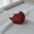 Natural Burma ruby gemstone on soft grey jewelry tray