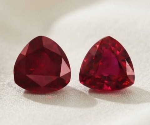 Natural Burma ruby matching pair on soft cream fabric