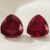 Natural Burma ruby matching pair on soft cream fabric