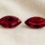 Natural marquise cut Burma ruby matching pair on soft cream fabric