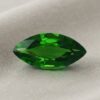 Natural marquise cut chrome tourmaline gemstone on soft beige fabric