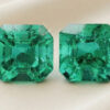 Natural Colombian emerald matching pair with GIA report on soft cream fabric