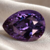Natural color change spinel gemstone on soft cream fabric